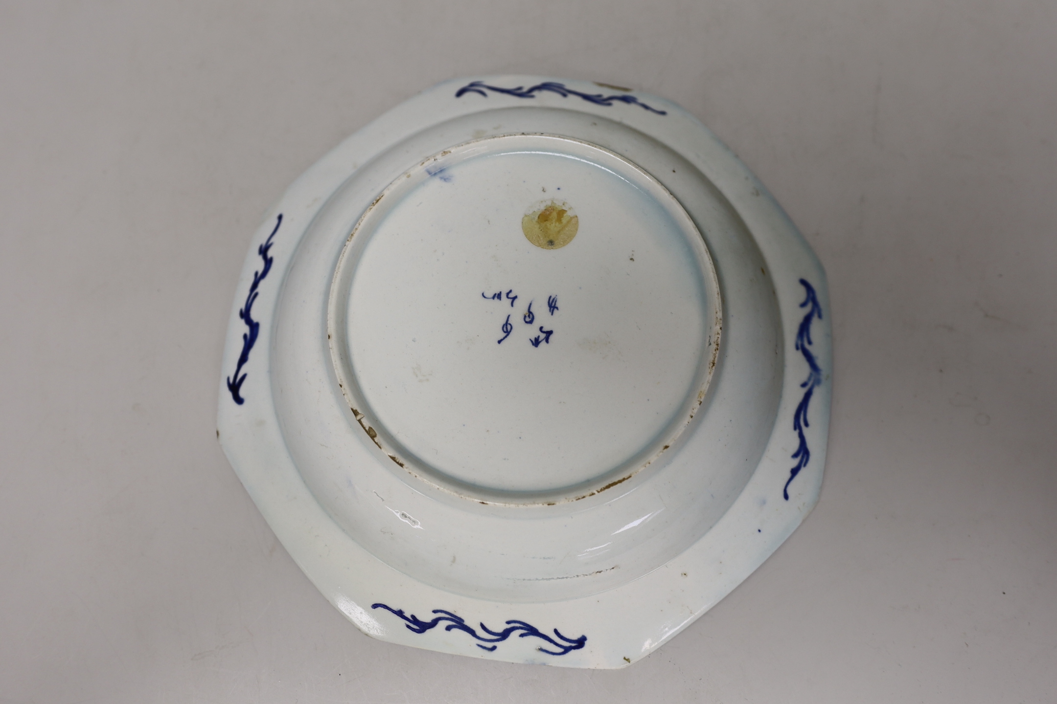 An 18th century Bow porcelain octagonal plate and two Bow pickle leaf dishes